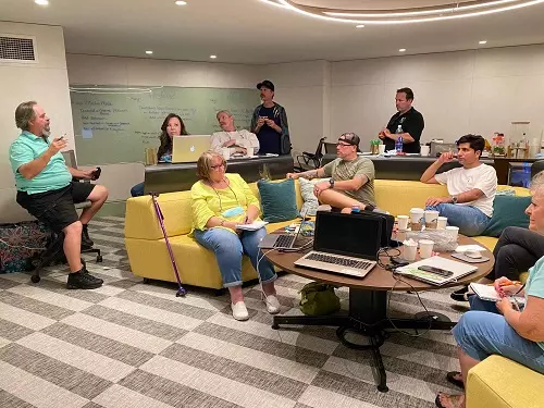 Vizz Web Solutions international team meeting discussing global software projects