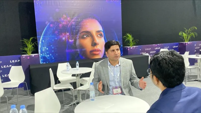 Vizz Web Solutions team in discussion at LEAP Year technology event
