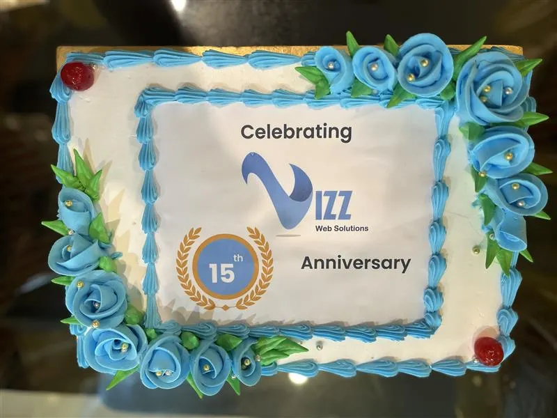 Vizz Web Solutions anniversary celebration with team and company achievements